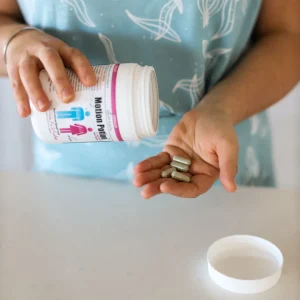Open bottle of Health Kultcha Motion Potion capsules for digestive support